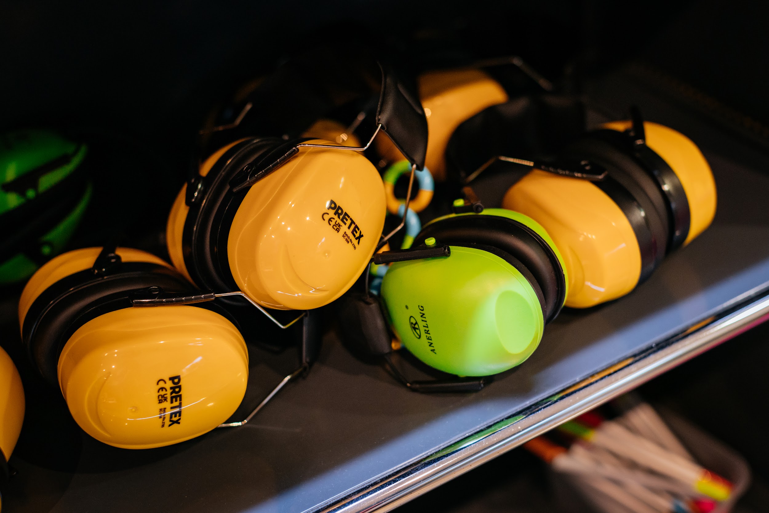 A collection of ear defenders, on a shelf in the discovery section at Project Art Centre. Photo by Simon Lazewski.